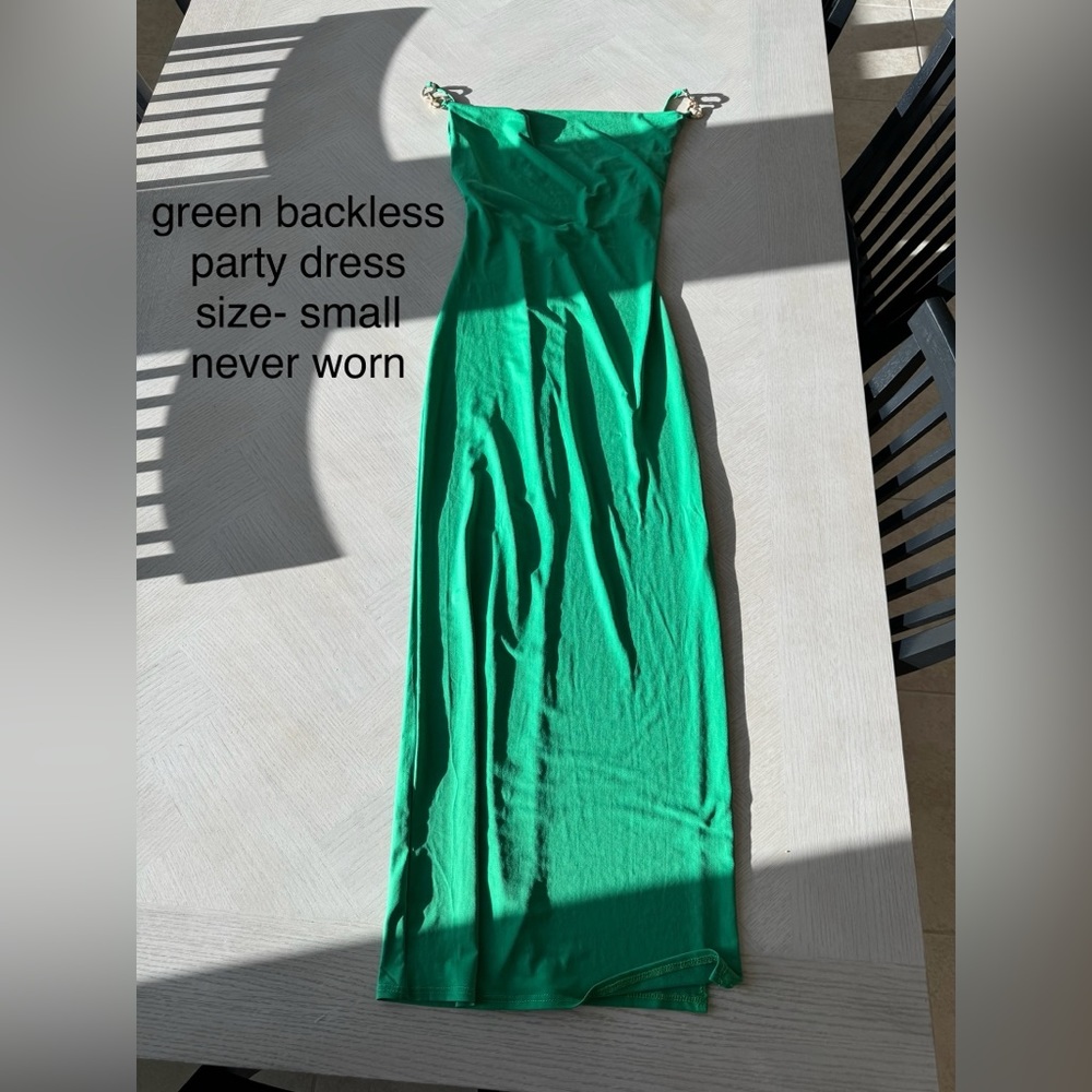 Green, body-con, backless dress with gold strap detailing. Never worn.